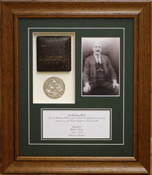 Framed orginal leather bound timber box with medal